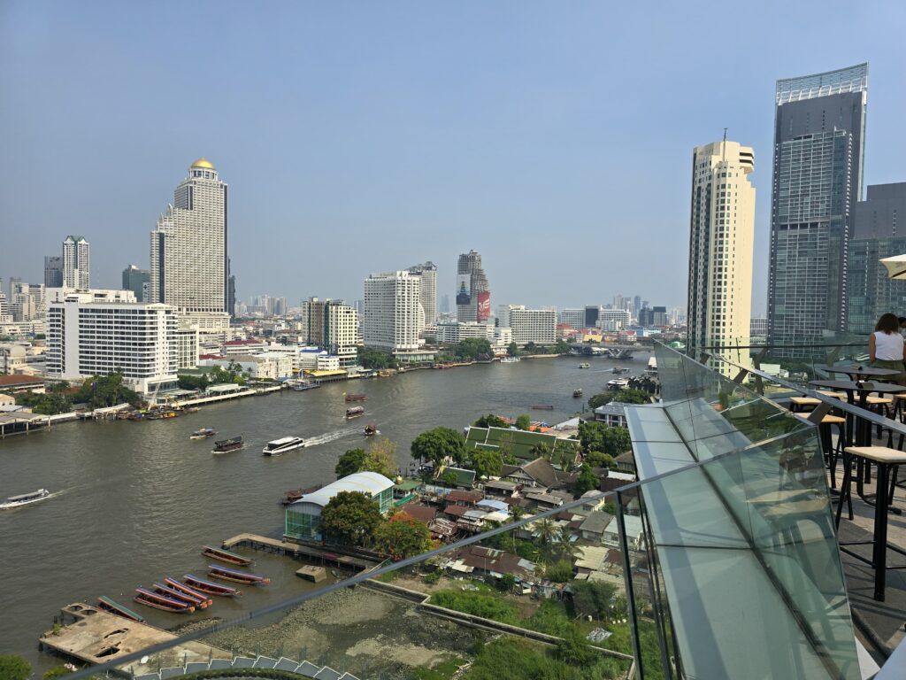 view of Chao Phraya river and the skyline of Bangkok.