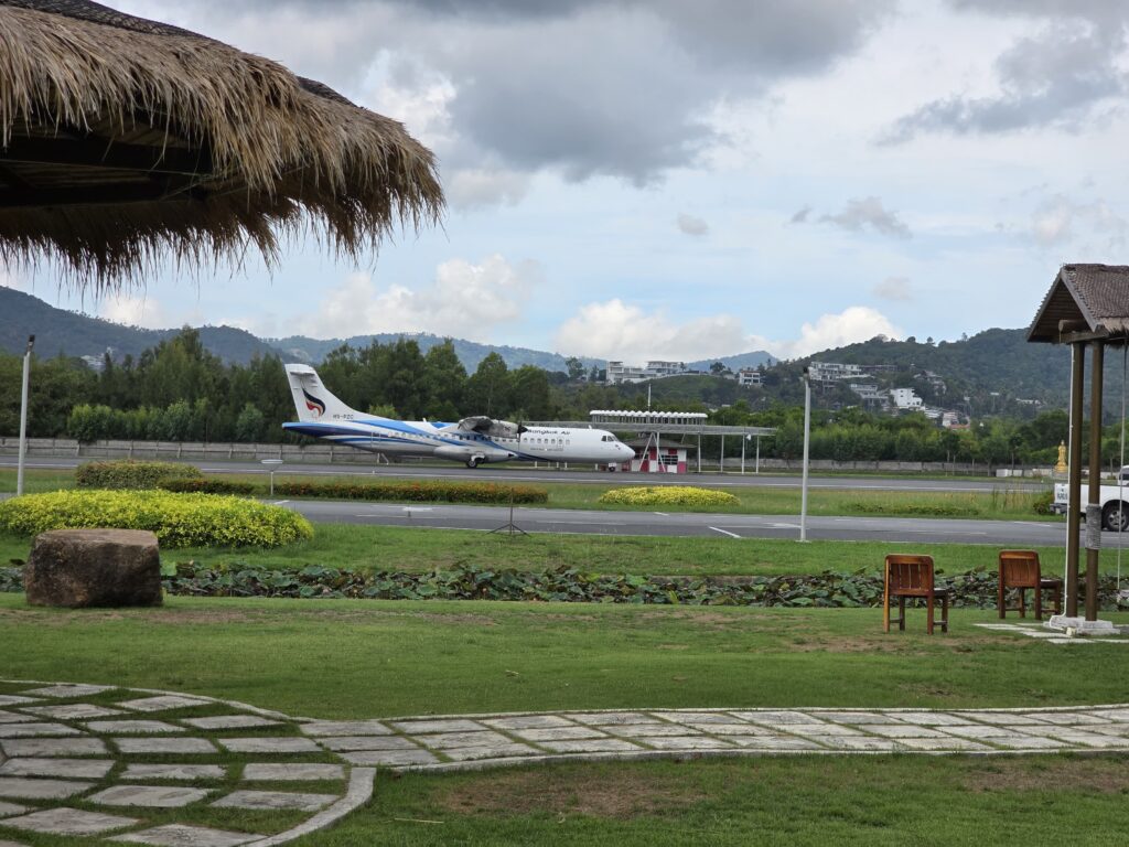 spectacular view of plane landing at Samui Airport, one can see surroundings by sitting in open air places