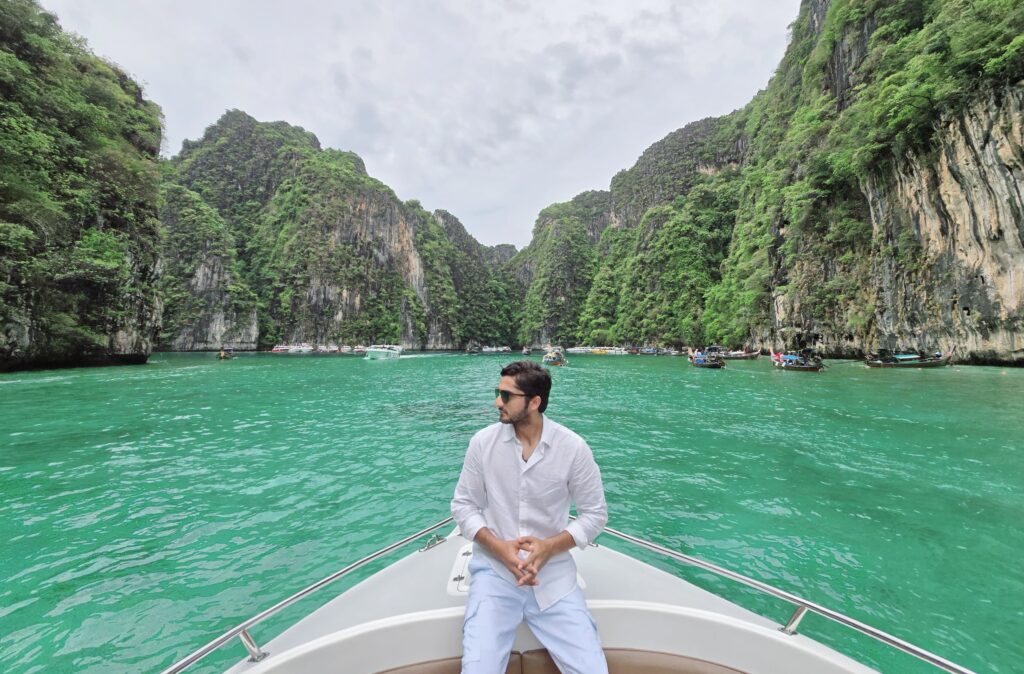 boat stops in front of Phi Lay Bay so tourists can take pictures.