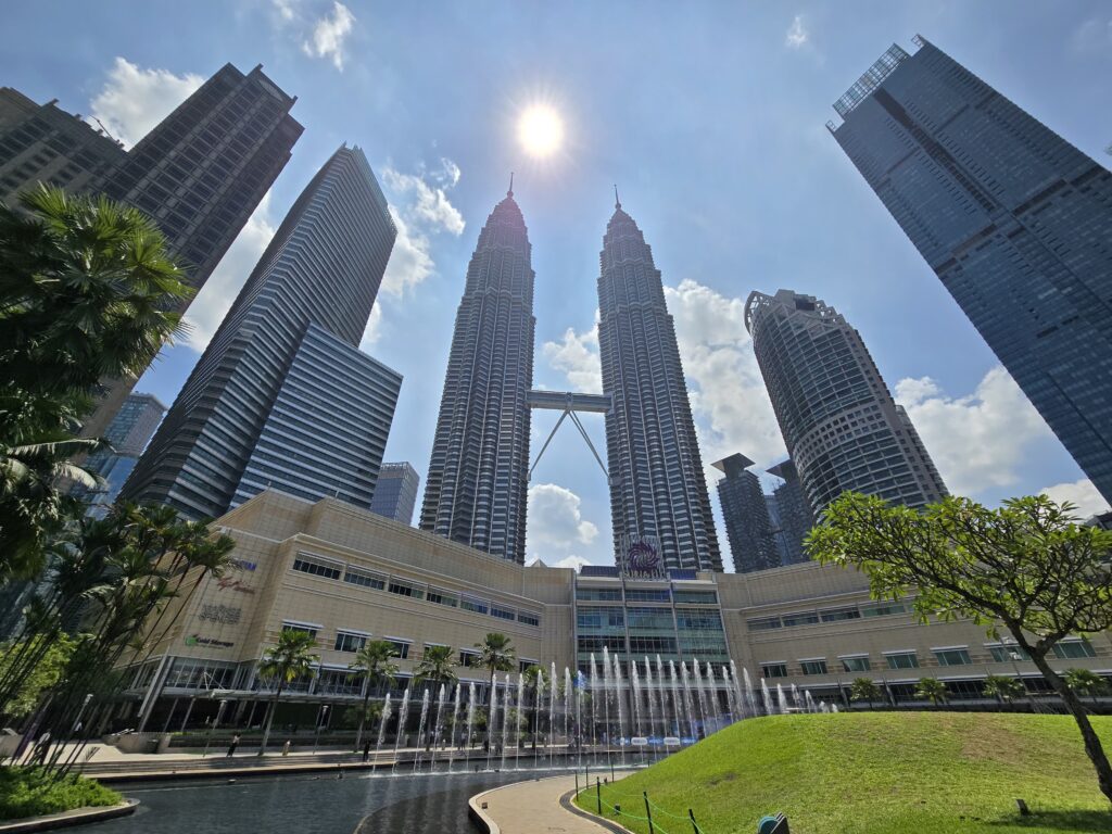 Petronas Twin towers shining bright in the day light.