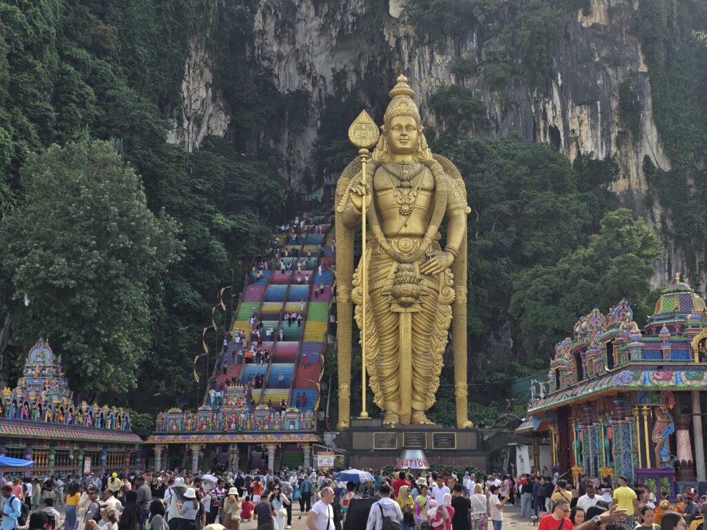 hundreds of tourists can be seen who are visiting Batu Caves