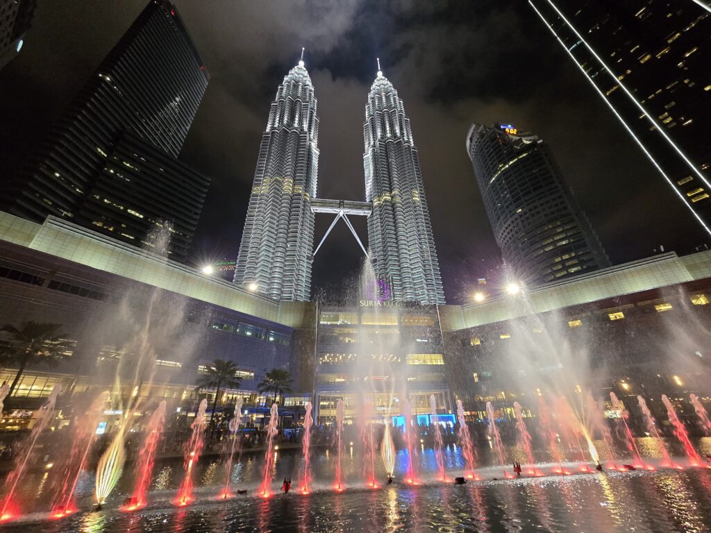 A spectacular view of the Twin Towers while a fountain show can be seen in the picture as well. 